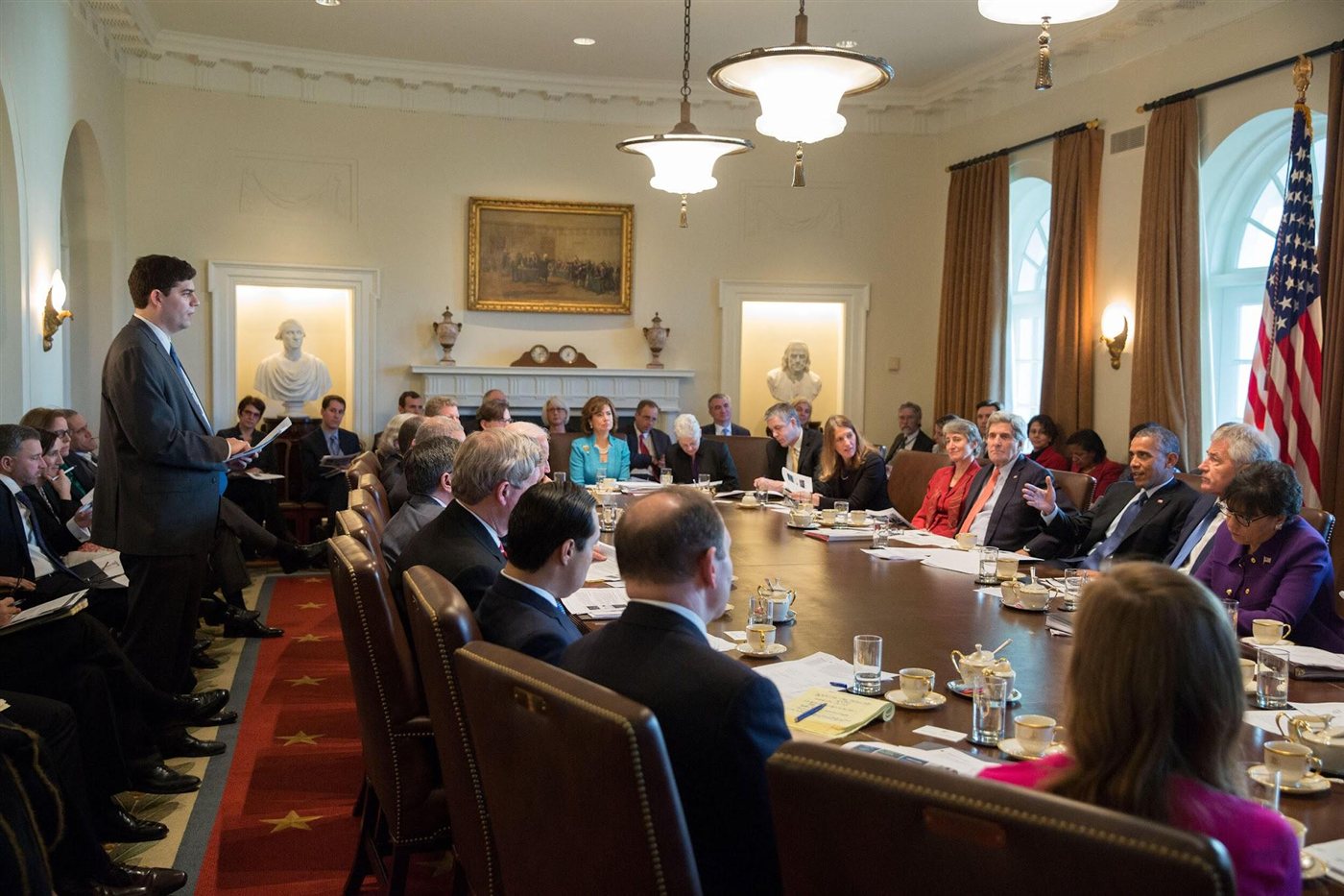Nathaniel Lubin presenting in the White House Cabinet Room to President Obama and senior staff